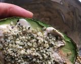 A picture of step 2 of Keto Friendly Avocado with tahini and hemp seed.