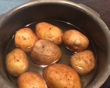 A picture of step 1 of Aloo (Potato) Bharta: 4 different types of 'Mashed Potatoes' with 'Desi Twists'.