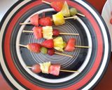 A picture of step 6 of Edible fruit arrangement on a pineapple boat.