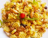 A picture of step 7 of Chicken Chilli Dry with flower macroni.