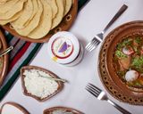 A picture of step 10 of Pozole Itakatl with Guajillo Sauce.