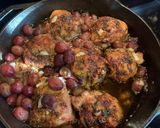 A picture of step 4 of Rosemary Chicken Thighs w Roasted Grapes and Smashed Parsnips.