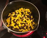 A picture of step 1 of Curry millet grain with black beans and sweet corn.
