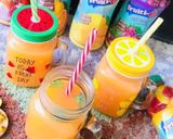A picture of step 4 of Orangy Mango Cocktail.