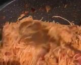 A picture of step 8 of Jollof spaghetti (restaurant version).