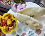 A picture of step 8 of Suji naan with achaari paneer and sirke wala pyaaz.