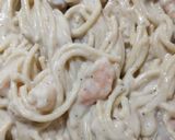 A picture of step 10 of Creamy alfredo chicken and shrimp pasta.