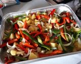 A picture of step 1 of Oven-Baked Chicken with Bell Peppers and Sweet Potatoes.