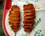 A picture of step 3 of Tornado Potatoes.