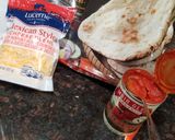 A picture of step 1 of Tandoori naan jalapeno cheese pizza.