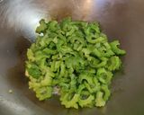 A picture of step 2 of Salted Egg Yolk with Bitter Gourd.