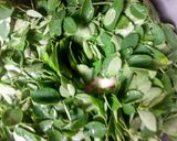 A picture of step 5 of Rice and beans with moringa leaves.