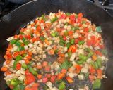 A picture of step 3 of Creole Smothered Pork Chops.