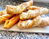 A picture of step 9 of Puff Pastry Twists with 'Nduja Spread, Speck, and Ragusano Cheese.