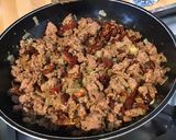 Une image de l'étape 9 de Porc aux tomates séchées, ail mariné, oignon et épices italiennes.