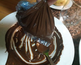 Foto del paso 7 de la receta: Bizcocho de naranja bañado en chocolate con almendras laminadas