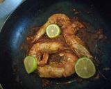 A picture of step 2 of Pad thai with king prawns and lemon slices and tagliatelle rice.