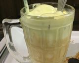 A picture of step 3 of Mango shake with ice cream.