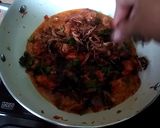 A picture of step 8 of Spicy chicken tikka biryani.