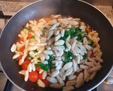 A picture of step 6 of Cavatelli with tomato and rocket.