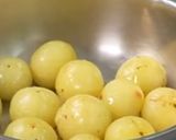 A picture of step 1 of Khati mithi amla candy.