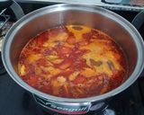 A picture of step 3 of Nam Ngiao (Northern Thai Pork Noodle Soup).