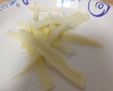 A picture of step 2 of String cheese slices.