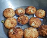 A picture of step 5 of Coconut fritters deep in sugar syrup.