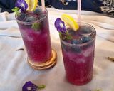 A picture of step 4 of Blue pea magic layered mocktail.