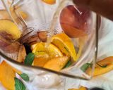 A picture of step 2 of Orange, Nectarine, Plum, and White Wine Sangria.