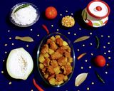 A picture of step 7 of Papaya and Fritters Curry.