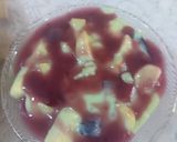A picture of step 4 of Pista fruit custard orange jelly with black currant sauce.