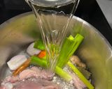 A picture of step 1 of Cook every part - Chicken broth (with some meat) from chicken back/carcass, and wing tips.