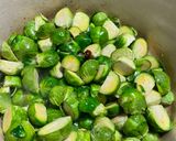 A picture of step 1 of Apple juice braised Brussels sprouts with bacon.