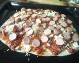 A picture of step 6 of Smokie pizza.