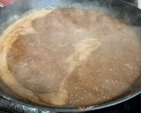A picture of step 2 of Choco Biko with white coconut shreds and toasted coconut.