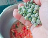 A picture of step 2 of Frozen peas tomato pulav.