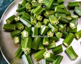 A picture of step 1 of Bhindi and Onion Fry with roasted cumin powder.