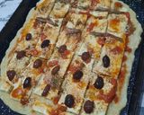 Foto del paso 9 de la receta: Pizza mitad anchoas, mitad olivas negras