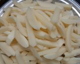 A picture of step 1 of Masala french fries.