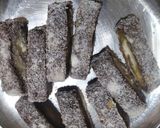 A picture of step 14 of Beetroot swiss roll with mango mava stuffing.