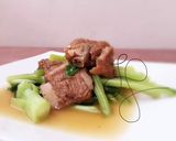 A picture of step 2 of Baby Bak Choy With Canned Stew Pork.