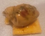 A picture of step 5 of Sweet Soy Spiced Oyster on White Cheddar Cracker.