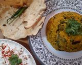 A picture of step 4 of Kathyawadi masala vegetable khichadi with masala curd, papad and 🌶.