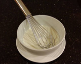 A picture of step 8 of Cinnamon Layer Cake with Whipped Cinnamon Cream Filling and Frosting.