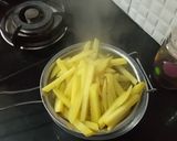 A picture of step 2 of Crispy honey chilli potato.