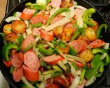 A picture of step 6 of Mike's Sizzling Sausage Egg & Potato Breakfast Skillets.