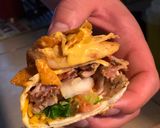 A picture of step 5 of STEAK and SHREDDED CHICKEN BURRITOS WITH MELTED CHEESE/FRITOS: JAYS SMOTHERED BURRITO.