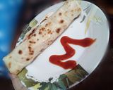 A picture of step 9 of Chicken filled Roti Roll.