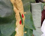 A picture of step 3 of Pabda Paturi (with Taro/ kochu/Alvi leaves) and Pabda Bhappa.